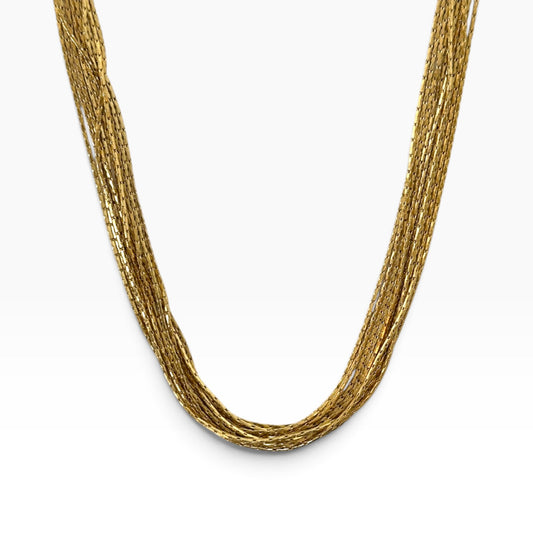 Collier Pao doré multirangs en acier inoxydable 316L sur fond blanc.